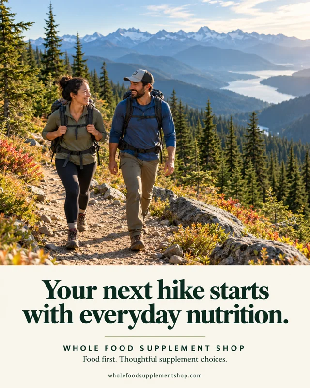 Two hikers overlooking a mountain lake